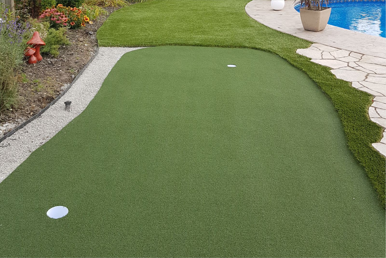 landscape turf with putting green in backyard