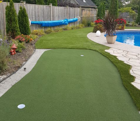 backyard turf poolside with putting green